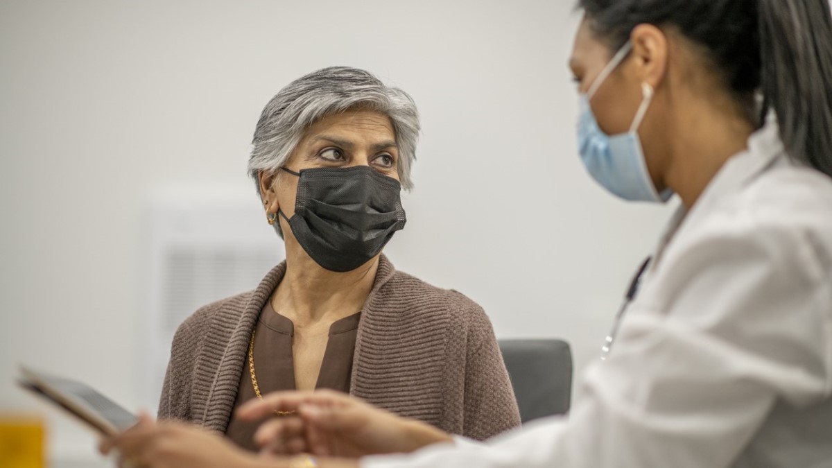 Doctor Patient una mujer hablando con su médica