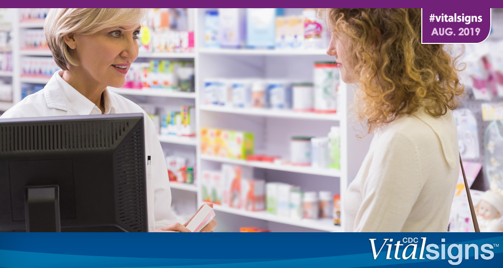 Life-Saving Naloxone from Pharmacies A pharmacist talks with a patient about a prescription.