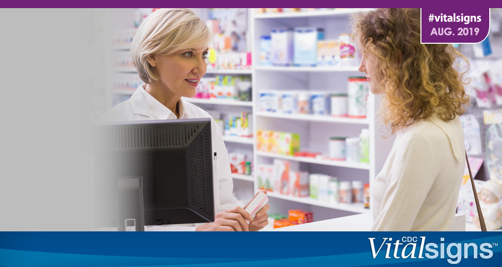 Life-Saving Naloxone from Pharmacies A pharmacist talks with a patient about a prescription.