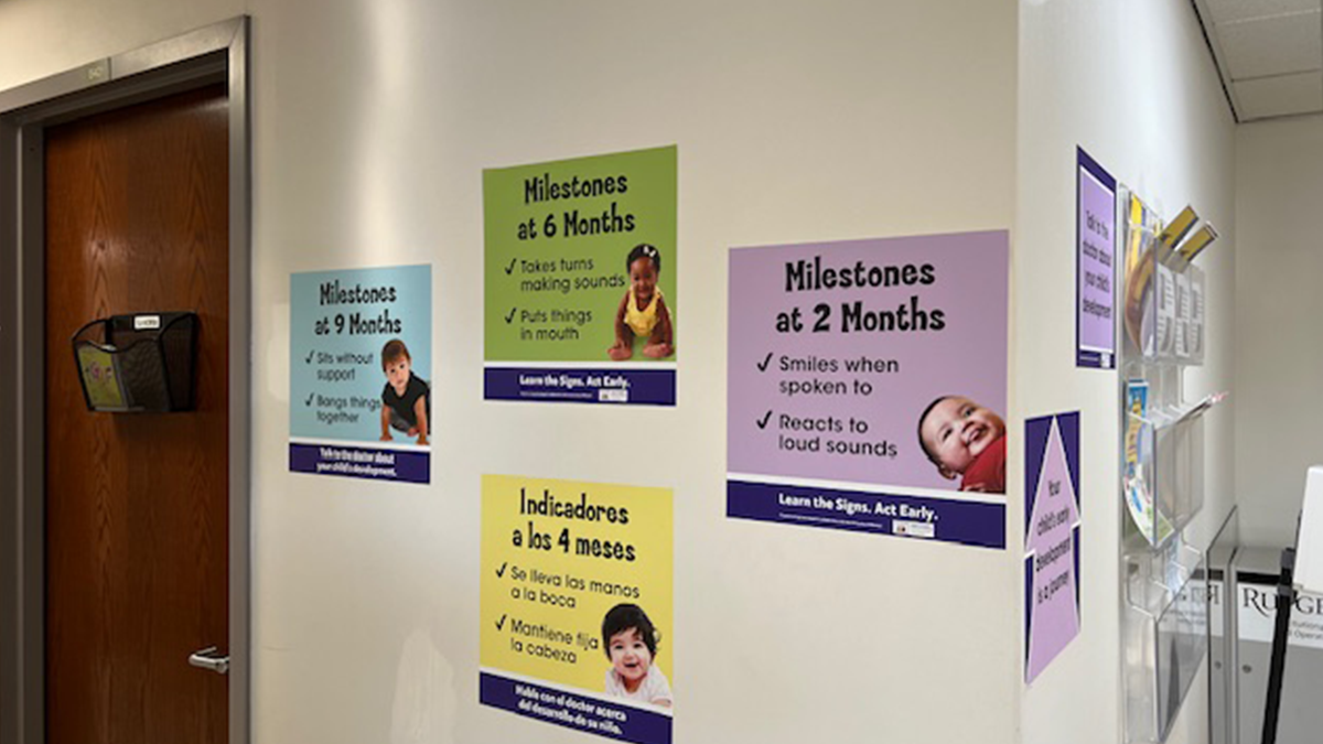 Milestone posters on wall of a clinic