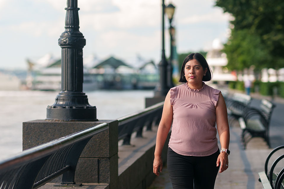 Nadia, a member who enrolled through young adult outreach,
walking by the river in NY.