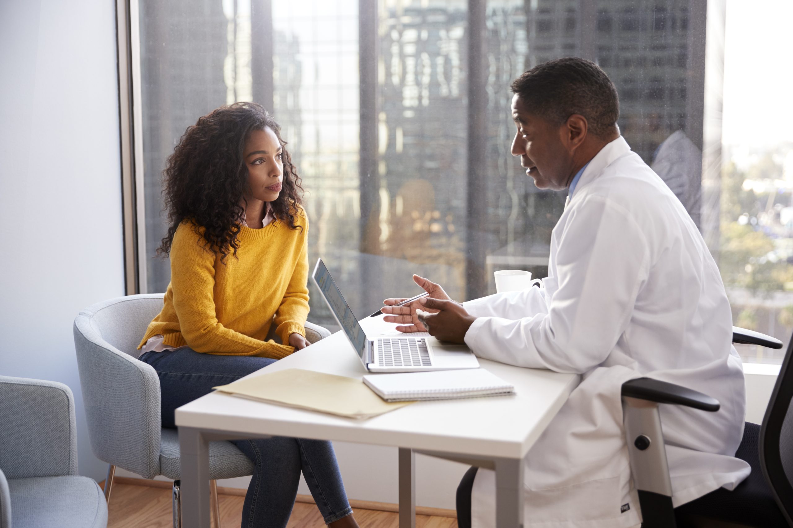 Healthcare professional talking to a traveler.
